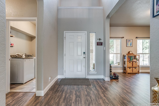 214 Ridge Blf, Cibolo, TX 78108 - foyer featuring wood finished floors, arched walkways, baseboards, and a textured wall