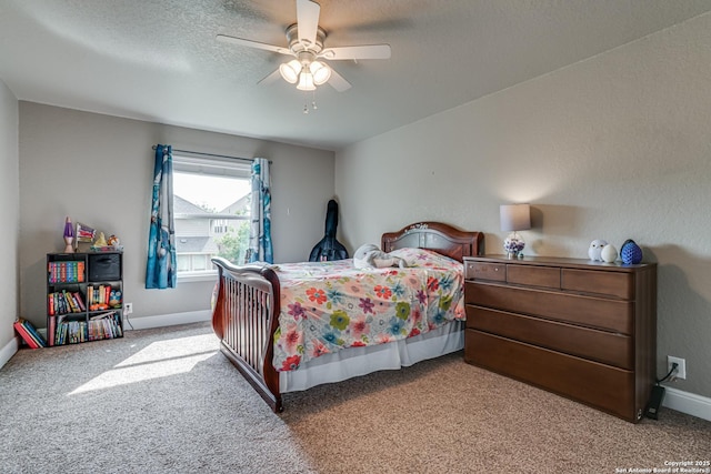 214 Ridge Blf, Cibolo, TX 78108 - bedroom featuring carpet floors, baseboards, ceiling fan, and a textured ceiling