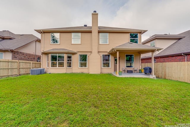 214 Ridge Blf, Cibolo, TX 78108 - rear view of house featuring a patio area, a chimney, and central air condition unit