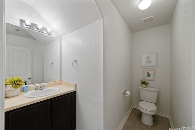 184 Jolie Cir, Boerne, TX 78015 - bathroom with vanity, toilet, tile patterned floors, and baseboards