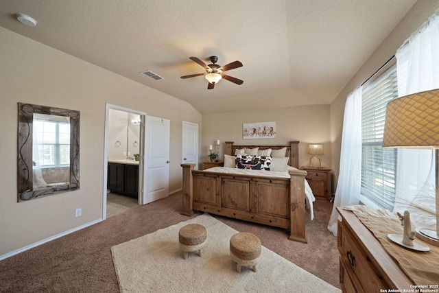 184 Jolie Cir, Boerne, TX 78015 - bedroom featuring light colored carpet, baseboards, ensuite bath, and a ceiling fan