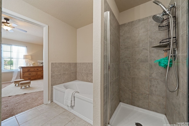 184 Jolie Cir, Boerne, TX 78015 - full bathroom featuring a stall shower, a bath, tile patterned floors, and a ceiling fan