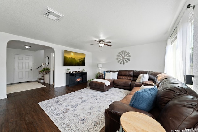 184 Jolie Cir, Boerne, TX 78015 - living area featuring arched walkways, ceiling fan, wood finished floors, and baseboards