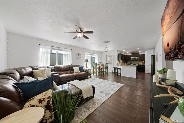 184 Jolie Cir, Boerne, TX 78015 - living room featuring a ceiling fan, dark wood-style flooring, a textured ceiling, and recessed lighting