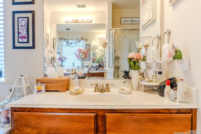 3351 Highline Trl, San Antonio, TX 78261 - full bathroom with vanity, a stall shower, and a chandelier