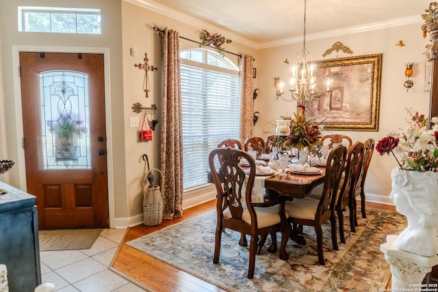 3351 Highline Trl, San Antonio, TX 78261 - dining space with a chandelier, crown molding, baseboards, and light wood-type flooring