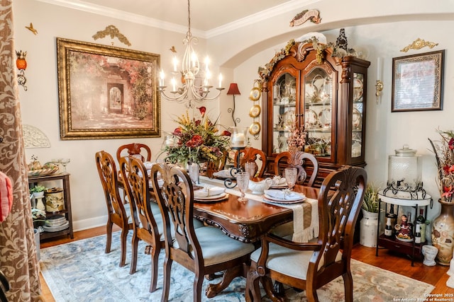 3351 Highline Trl, San Antonio, TX 78261 - dining area featuring a chandelier, wood finished floors, crown molding, and baseboards