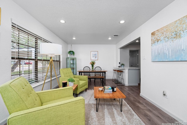 351 Barbara, San Antonio, TX 78216 - living room featuring wood finished floors, recessed lighting, baseboards, and a textured ceiling