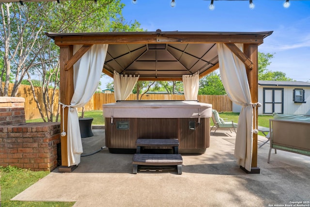 351 Barbara, San Antonio, TX 78216 - view of patio / terrace featuring a hot tub, a gazebo, a fenced backyard, and an outdoor structure