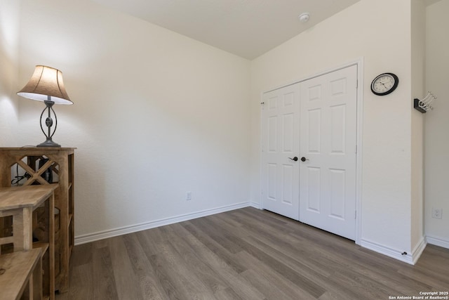22363 Escalante Run, San Antonio, TX 78261 - unfurnished bedroom featuring wood finished floors, baseboards, and a closet
