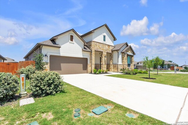1624 Dirndl, New Braunfels, TX 78132 - view of front of house featuring stone siding, stucco siding, driveway, and a garage