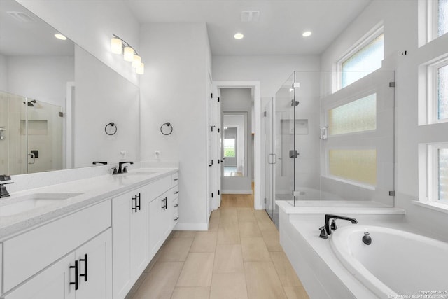 1624 Dirndl, New Braunfels, TX 78132 - full bath with a stall shower, a garden tub, double vanity, recessed lighting, and tile patterned floors