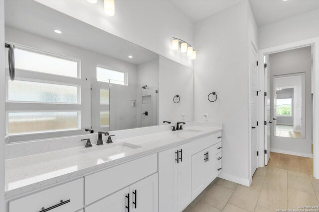 1624 Dirndl, New Braunfels, TX 78132 - full bath with a stall shower, double vanity, recessed lighting, tile patterned floors, and baseboards