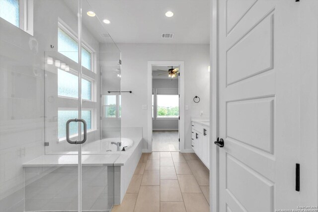 1624 Dirndl, New Braunfels, TX 78132 - bathroom with vanity, a stall shower, a ceiling fan, recessed lighting, and a garden tub