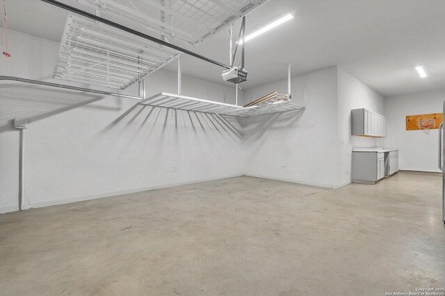 1624 Dirndl, New Braunfels, TX 78132 - garage featuring a garage door opener and baseboards