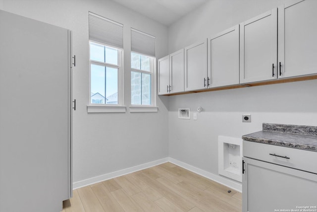 1624 Dirndl, New Braunfels, TX 78132 - laundry area featuring electric dryer hookup, cabinet space, hookup for a gas dryer, light wood-type flooring, and hookup for a washing machine