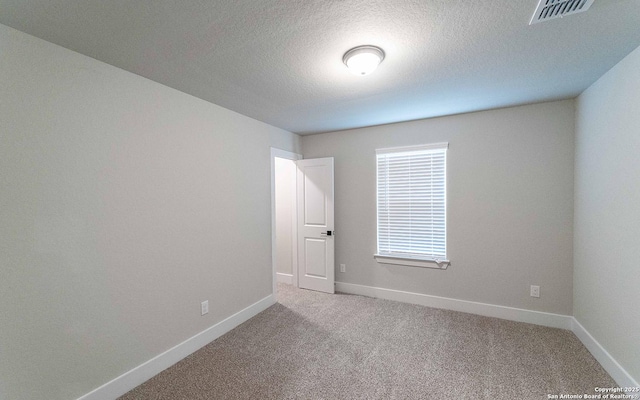 13226 Blue Flame, San Antonio, TX 78245 - carpeted empty room featuring baseboards and a textured ceiling