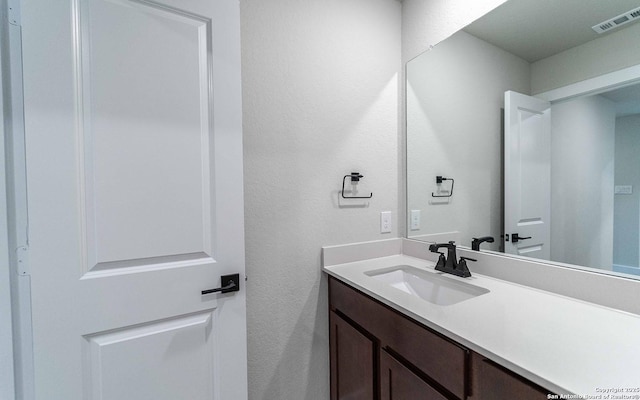 13226 Blue Flame, San Antonio, TX 78245 - bathroom featuring vanity and a textured wall