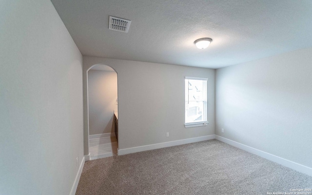 13226 Blue Flame, San Antonio, TX 78245 - carpeted empty room with arched walkways and baseboards