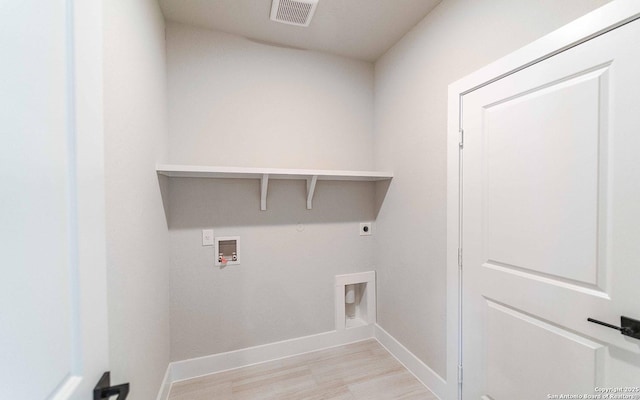 13226 Blue Flame, San Antonio, TX 78245 - washroom with hookup for an electric dryer, light wood finished floors, baseboards, and washer hookup