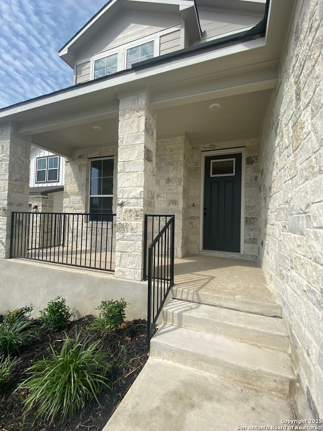 11111 Carlyle Spgs, Live Oak, TX 78233 - doorway to property with stone siding and a porch