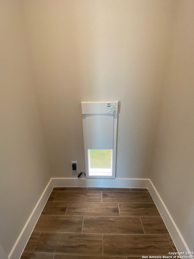 11111 Carlyle Spgs, Live Oak, TX 78233 - laundry room featuring wood finish floors and baseboards