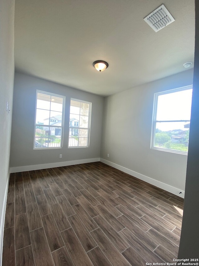 11111 Carlyle Spgs, Live Oak, TX 78233 - unfurnished room with dark wood finished floors and baseboards