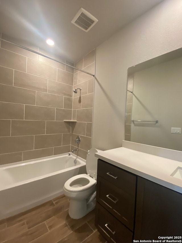 11111 Carlyle Spgs, Live Oak, TX 78233 - full bathroom featuring vanity, toilet, bathtub / shower combination, wood finished floors, and recessed lighting