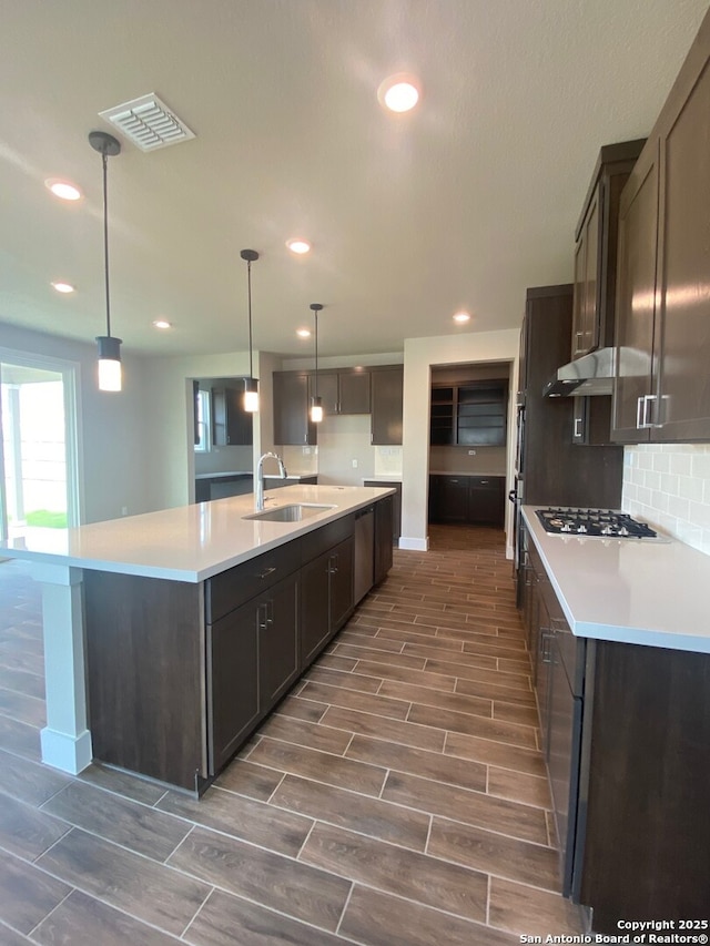 11111 Carlyle Spgs, Live Oak, TX 78233 - kitchen featuring a sink, appliances with stainless steel finishes, recessed lighting, backsplash, and wood finish floors
