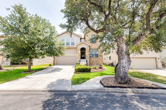 23022 Airedale Ln, San Antonio, TX 78260 - view of front of property with concrete driveway, an attached garage, a front yard, stucco siding, and central air condition unit