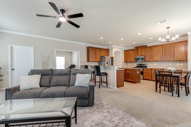 23022 Airedale Ln, San Antonio, TX 78260 - living room featuring light colored carpet, ornamental molding, a chandelier, recessed lighting, and a ceiling fan
