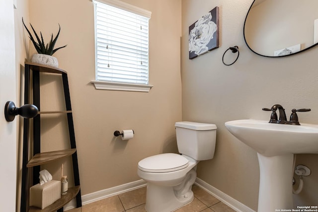 23022 Airedale Ln, San Antonio, TX 78260 - half bath with toilet, tile patterned floors, baseboards, and a sink