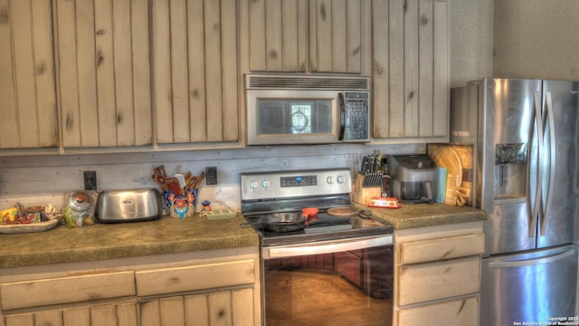 121 David Rankin Rd, Leakey, TX 78873 - kitchen featuring appliances with stainless steel finishes and dark countertops