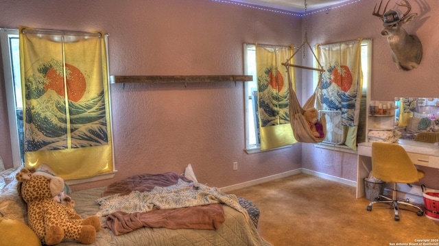 121 David Rankin Rd, Leakey, TX 78873 - bedroom with carpet flooring, a textured wall, multiple windows, and baseboards