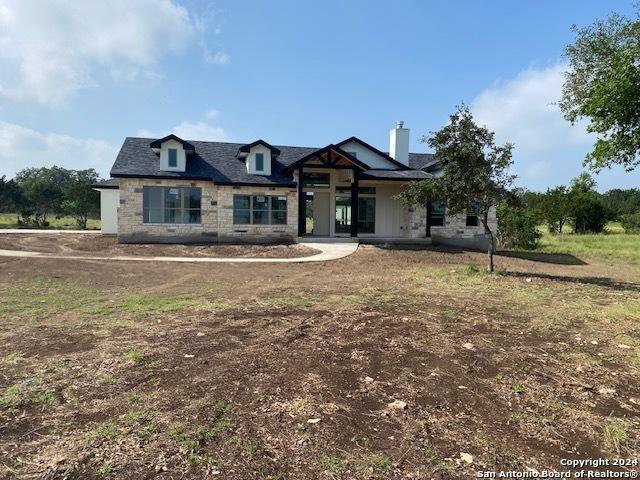 140 Horsehoe Fls, Bandera, TX 78003 - view of front facade with a chimney