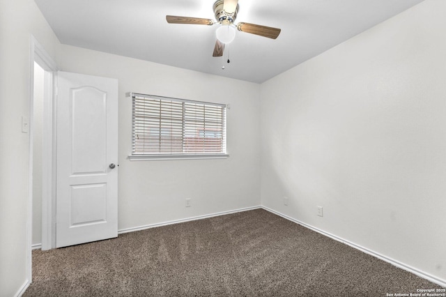 15515 Spring Smt, San Antonio, TX 78247 - empty room with dark colored carpet, a ceiling fan, and baseboards