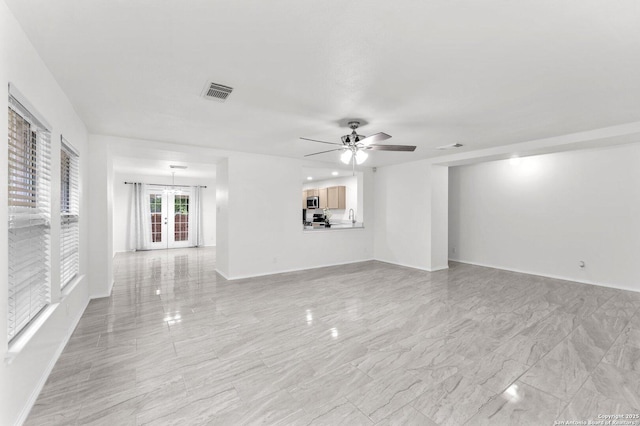 15515 Spring Smt, San Antonio, TX 78247 - unfurnished living room with french doors, ceiling fan, and baseboards