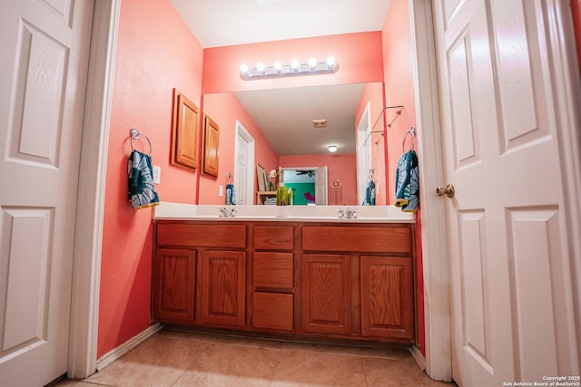 10715 Palomino, San Antonio, TX 78254 - full bathroom with double vanity, tile patterned flooring, and baseboards