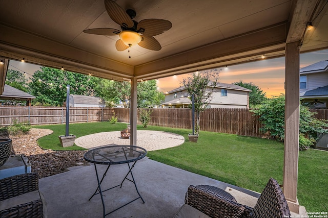 10715 Palomino, San Antonio, TX 78254 - patio terrace at dusk with a ceiling fan