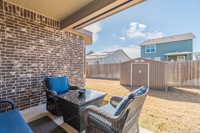 2564 Ayers, Seguin, TX 78155 - view of patio / terrace featuring an outdoor hangout area, a fenced backyard, a shed, and an outbuilding