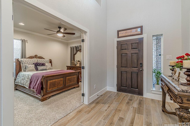 2564 Ayers, Seguin, TX 78155 - foyer with ornamental molding, light wood-style floors, ceiling fan, and baseboards