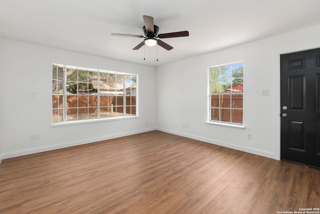 10707 Musket, San Antonio, TX 78224 - unfurnished room with wood finished floors, baseboards, and a ceiling fan