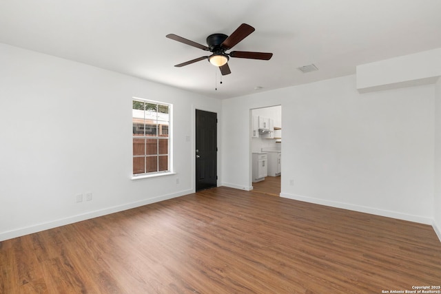 10707 Musket, San Antonio, TX 78224 - unfurnished room with a ceiling fan, wood finished floors, and baseboards