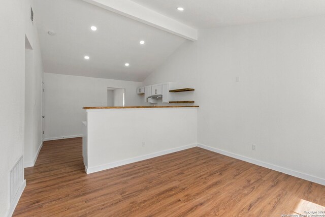 10707 Musket, San Antonio, TX 78224 - kitchen with light wood-type flooring, recessed lighting, white cabinetry, and baseboards
