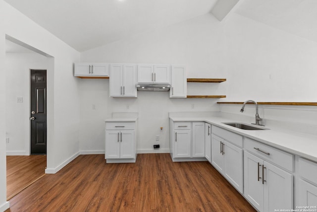 10707 Musket, San Antonio, TX 78224 - kitchen with a sink, dark wood-type flooring, light countertops, open shelves, and beamed ceiling
