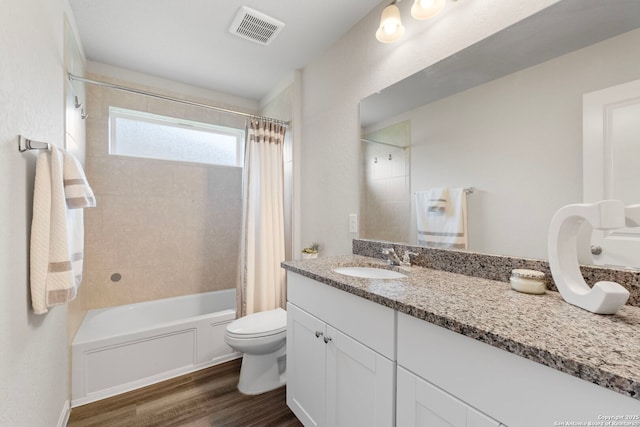 6038 Ballast Trl, New Braunfels, TX 78132 - full bath featuring wood finished floors, toilet, shower / tub combo with curtain, and vanity