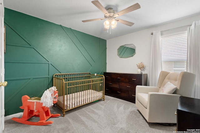 6038 Ballast Trl, New Braunfels, TX 78132 - carpeted bedroom featuring a crib and ceiling fan