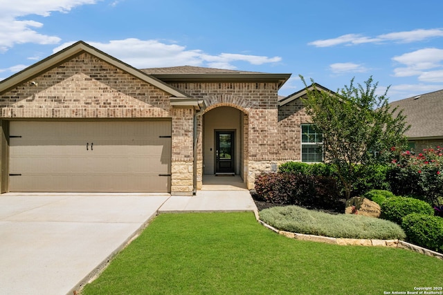 6038 Ballast Trl, New Braunfels, TX 78132 - french provincial home featuring driveway, brick siding, an attached garage, and a front yard