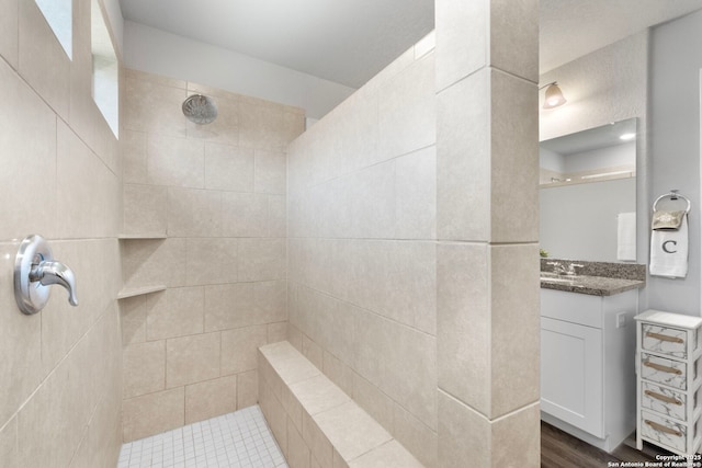 6038 Ballast Trl, New Braunfels, TX 78132 - full bath with tiled shower, vanity, and wood finished floors