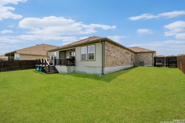 6038 Ballast Trl, New Braunfels, TX 78132 - back of property with a wooden deck, central AC unit, and brick siding